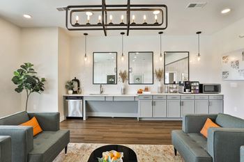 a living room with couches and a coffee table at Aventura at Hawk Ridge, Lake St Louis, 63367